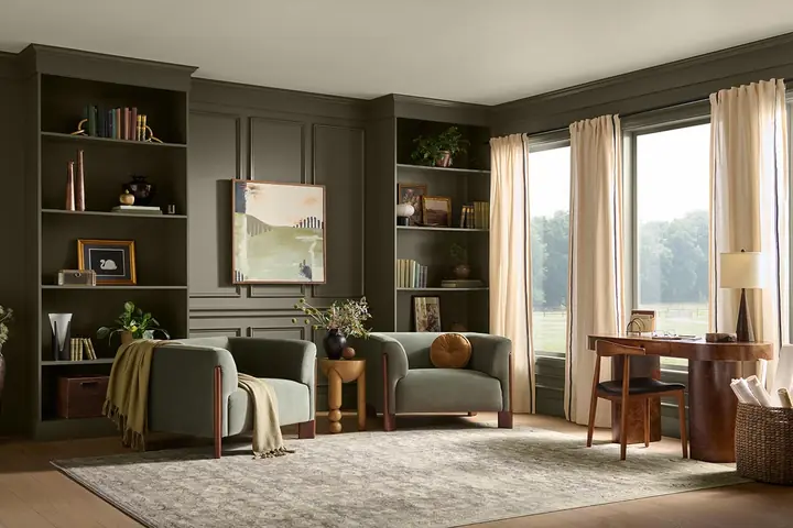 A living room painted in Grounded, BEHR’s Color of the Year 2027